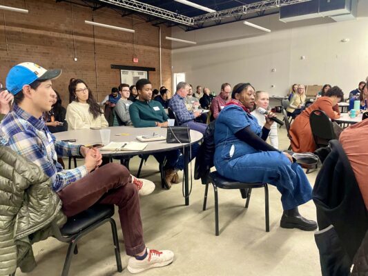 Audience asks questions during Impact 704 Academy